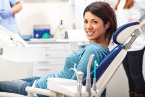 a patient smiling after her sedation dentistry