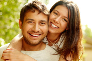 Dental Patients Smiling With Well Cared For Dental Implants In San Antonio, TX
