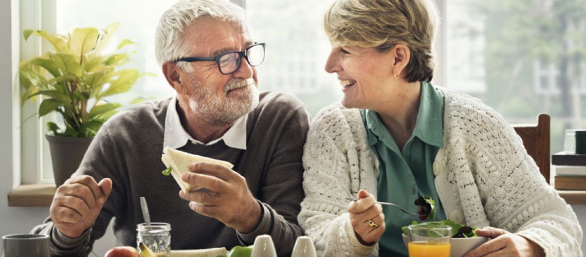 Dental Implant Patients Eating Together In San Antonio, TX